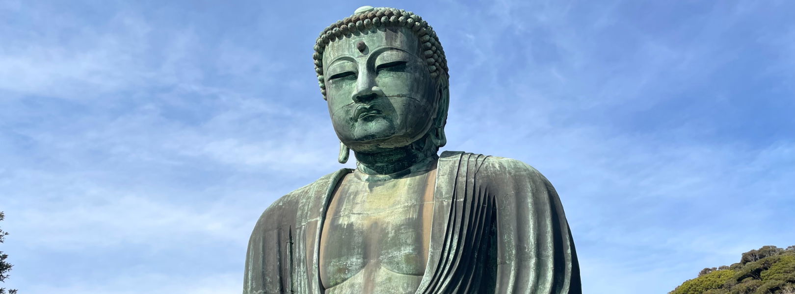 Great Buddha statue under a clear blue sky