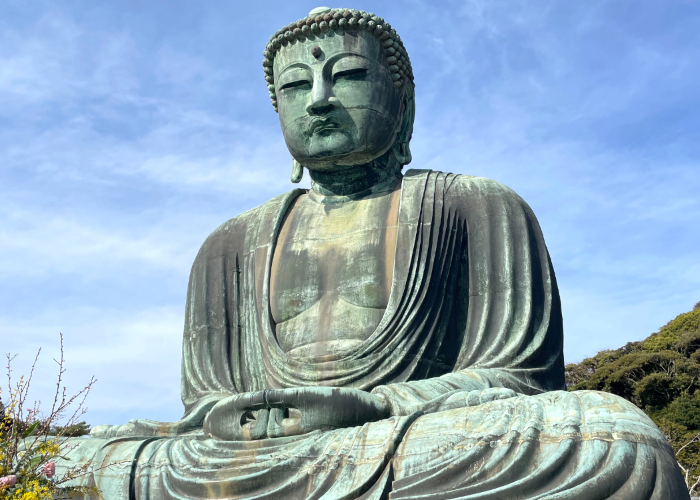 Kamakura Daibutsu, the Great Buddha of Kamakura, against a blue sky