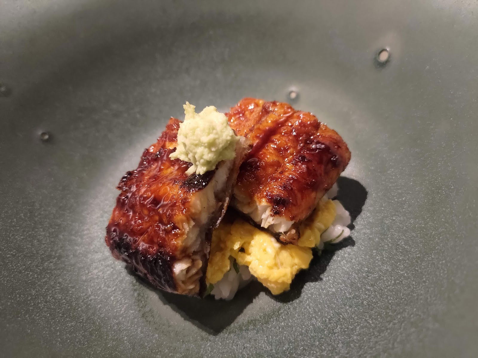 Delicious grilled eel served on rice with wasabi garnish
