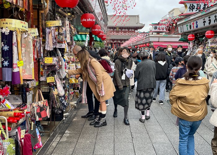People look at shops on Nakamise street in Asakusa, Tokyo Japan
