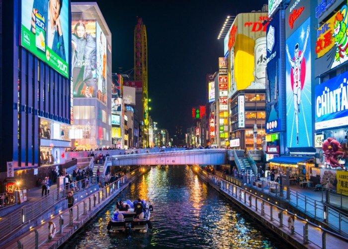 Famous glico man billboard in Osaka and other advertising show around Dotonburi canal at night