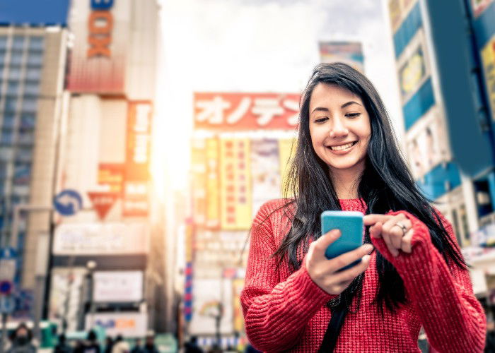 Women in Tokyo using smartphone