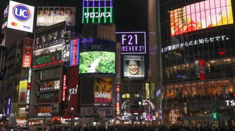 The neon streets of Shibuya at night.