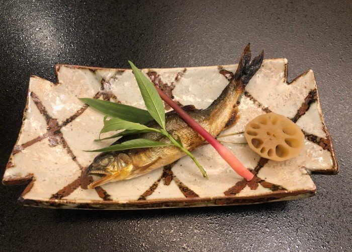 Sweet fish or Ayu Grilled Japanese on traditional kaiseki dish.