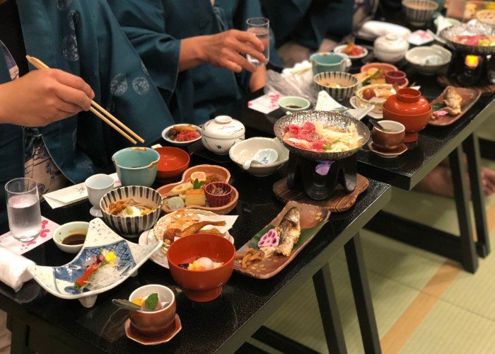 While have a Japanese food Kaiseki set dinner at Ryokan “Japanese style hotel”, Takayama Japan