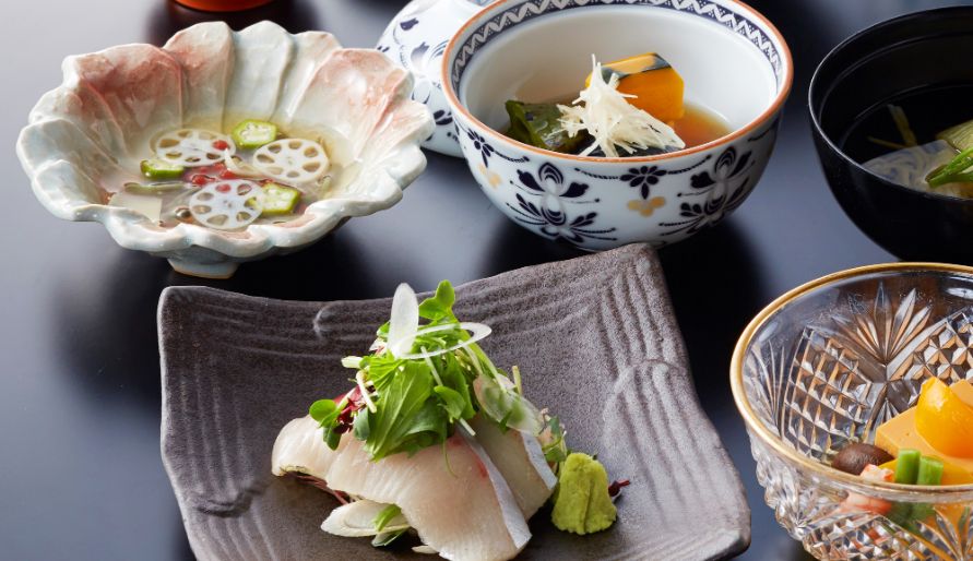 Exquisite Japanese course menu with sashimi and traditional dishes
