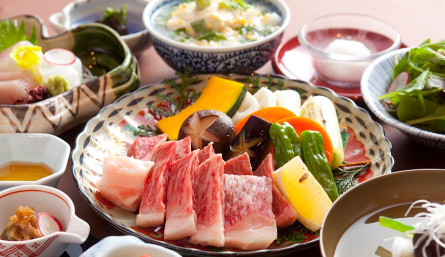 Authentic Japanese course meal with fresh sashimi and vegetables