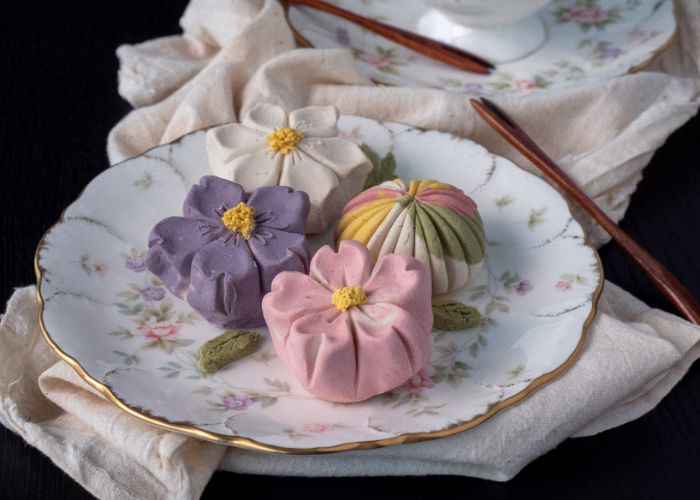 Four types of wagashi on a porcelain plate