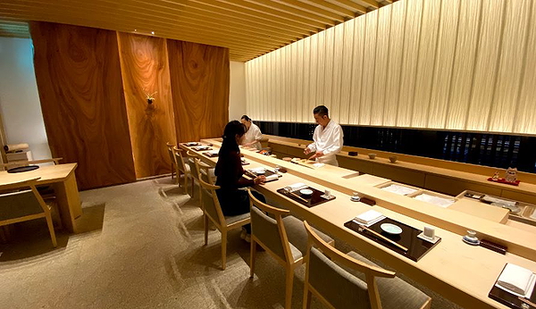 Elegant modern sushi bar with chef preparing dishes