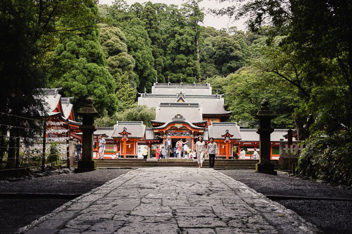 Bright red shrine nestled in a forest 