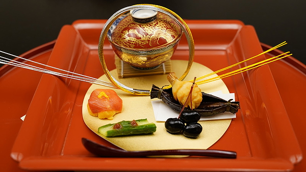 Exquisite Japanese kaiseki platter with intricate garnishes