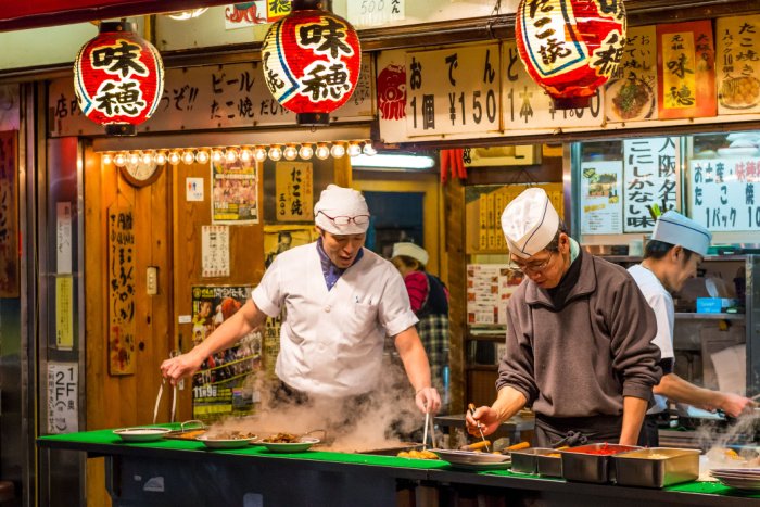 Two chefs cook Osaka street food