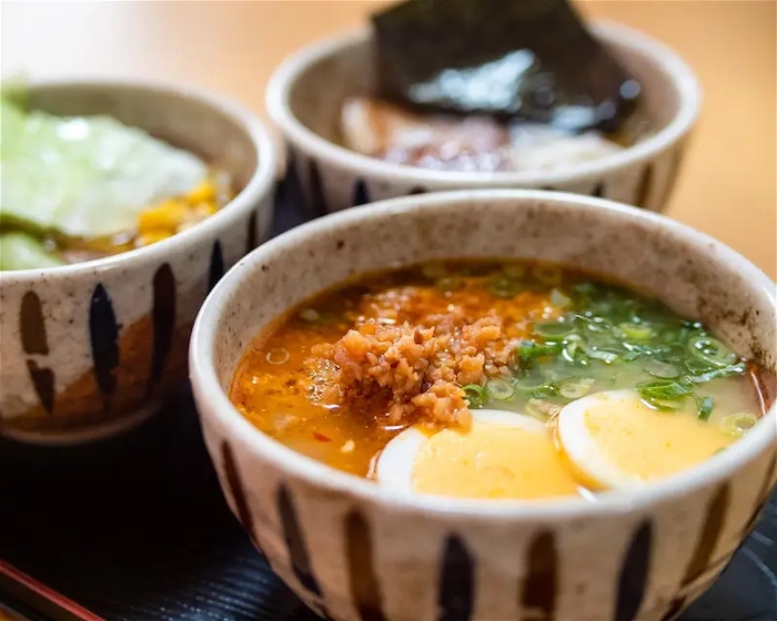 Three types of Japanese ramen on a tray