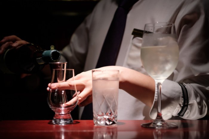A bartender pours drinks at a fancy Tokyo bar