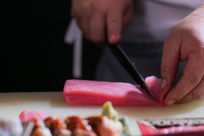 Close-up of a chef slicing sashimi