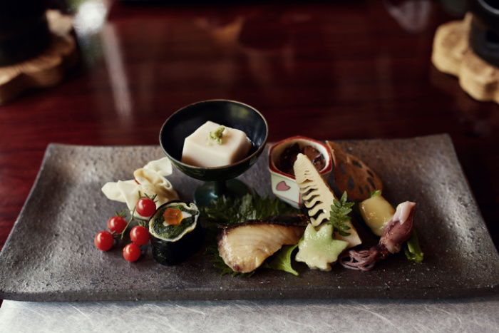 An assorted tofu and vegetable dish in traditional Japanese cuisine