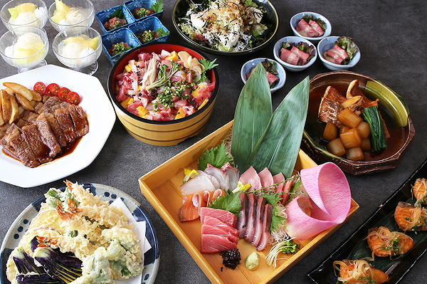 Colorful Japanese feast with sashimi and various side dishes