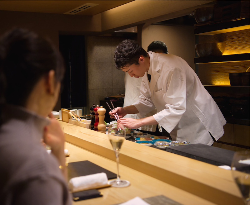 The chef at Yakiniku Kappo Note carefully preparing the next course.