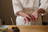 Chef preparing sushi at a Japanese restaurant, hands forming perfect nigiri