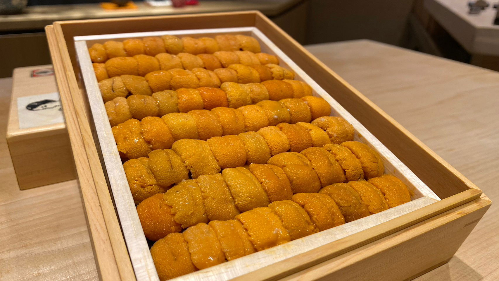 A full tray of uni urchin sushi waiting to be served at Sushi Oumi.