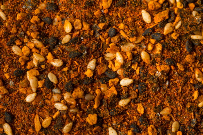 Close-up of spicy shichimi togarashi seasoning with sesame and chili flakes