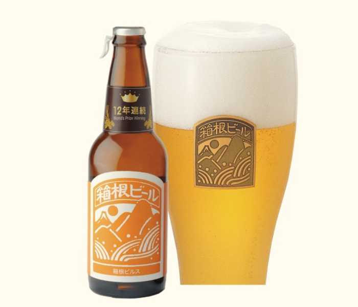 A bottle of award winning Hakone craft beer with a filled glass of beer beside it