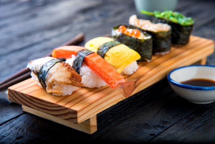 A colorful platter of nigiri sushi