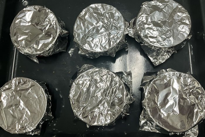 Japanese pudding in ramekins, covered in foil for baking