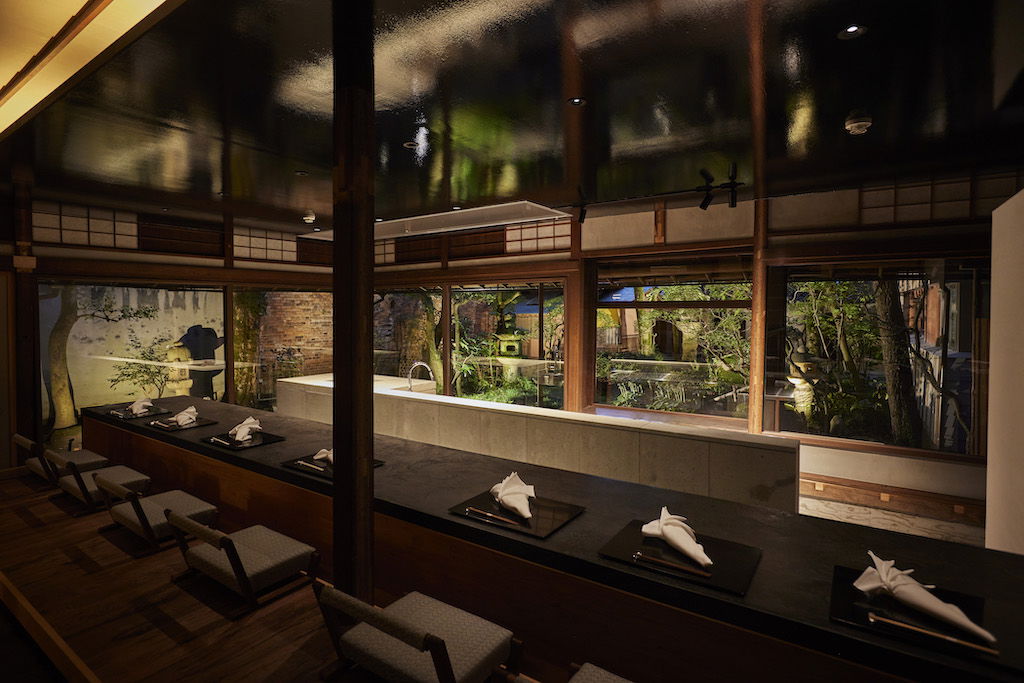 The stylish interiors of Ahora Aqui, looking out onto a Japanese garden.