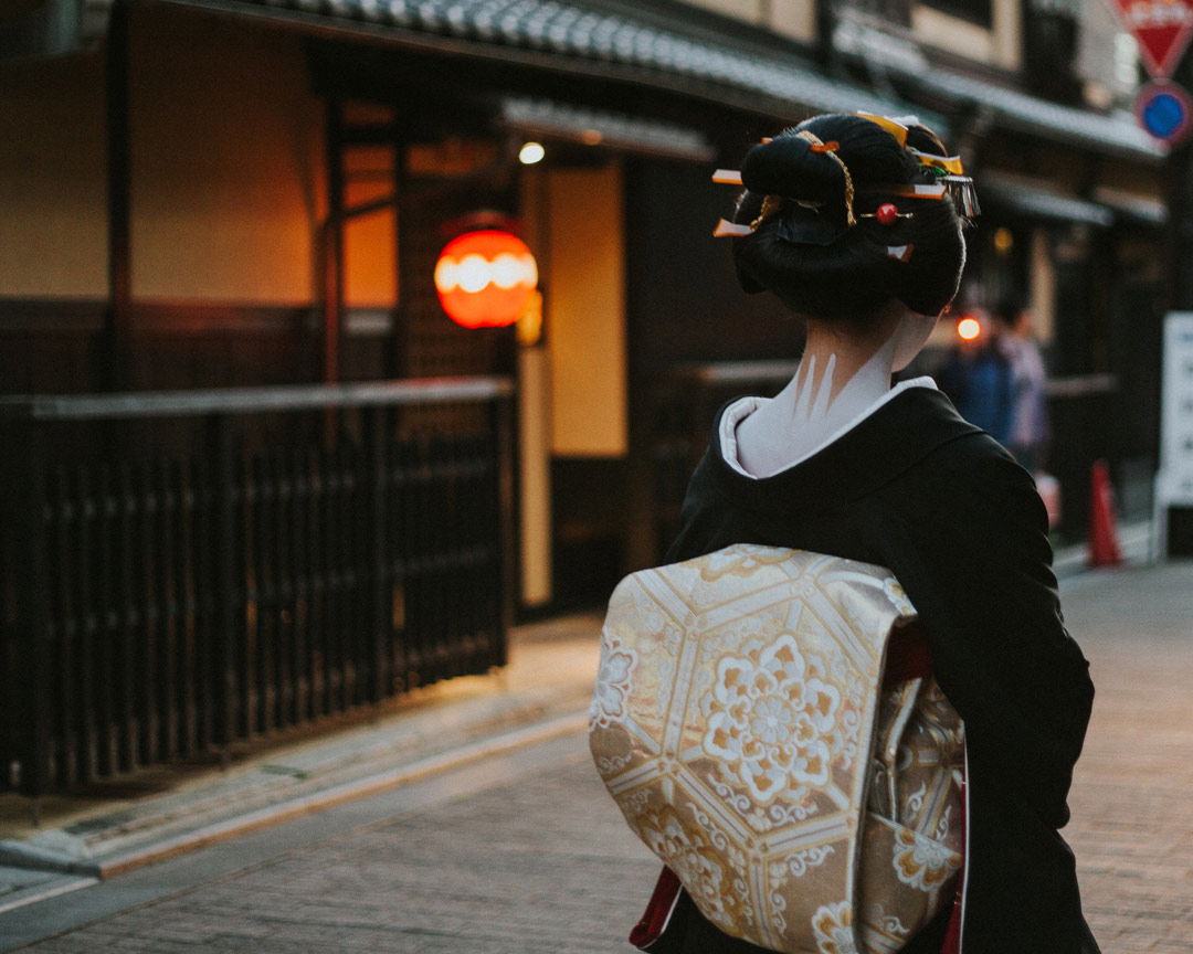 The demure back profile of a geisha in Kyoto, as you may see at this Geisha show and lunch in Gion.