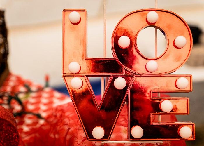 Love sign against a red and white background