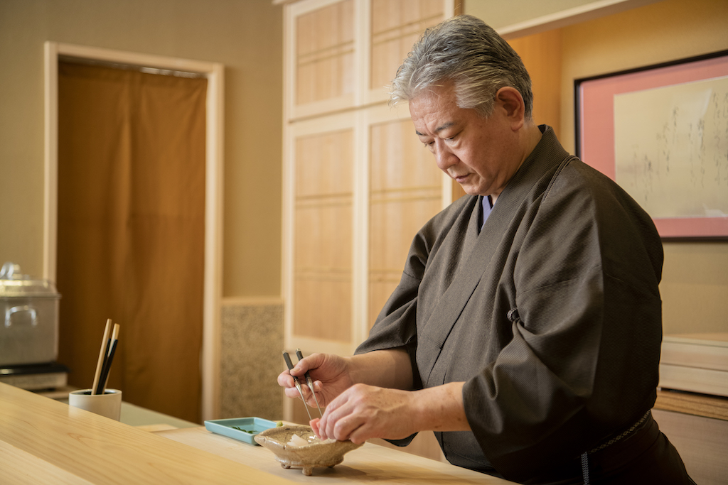Toyoda owner Hashimoto Toru preparing a dish