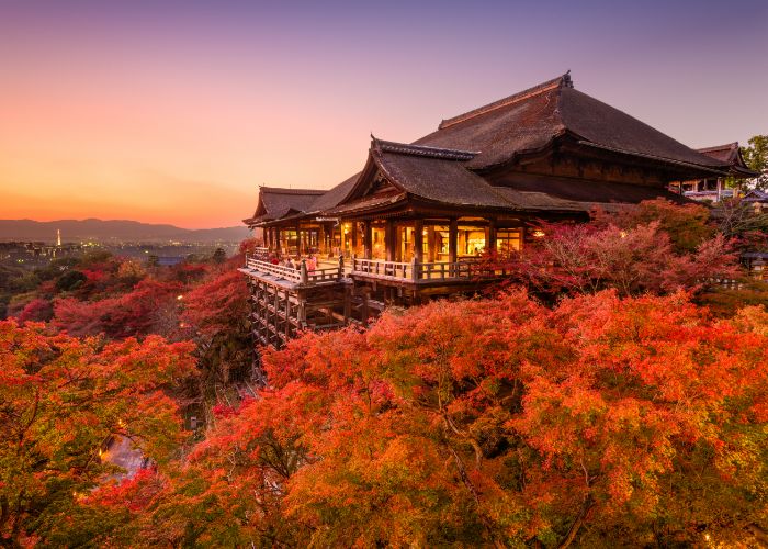 The famous Kiyomizudera temple framed by the vibrant colors of fall in Japan.