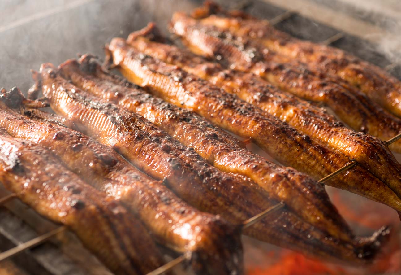 Unagi eel being skewered and grilled at Maruichi Fuji Akasaka.