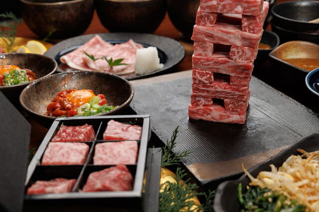 Gourmet beef dishes on a restaurant course menu table
