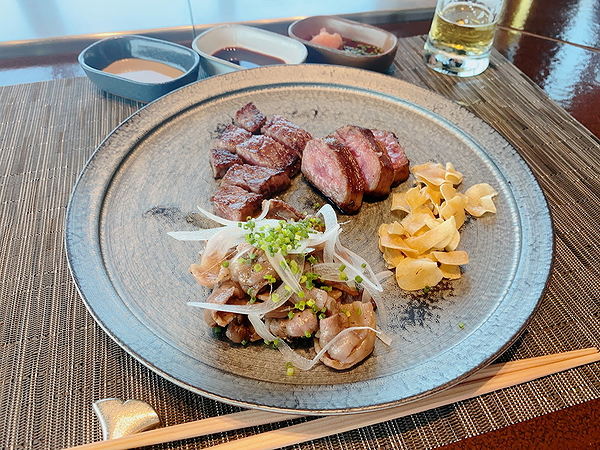 Gourmet steak dinner with onions and garlic on elegant plate