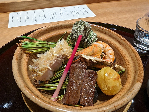 Gourmet Japanese dish with assorted seafood and meats
