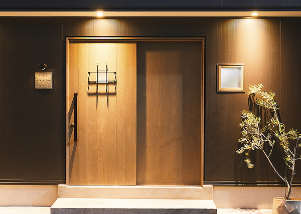 Elegant restaurant entrance with warm lighting and modern design