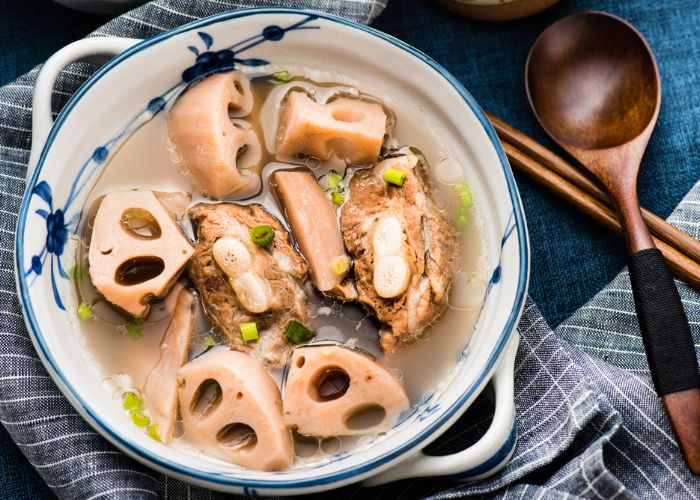 A bowl of stew with pork ribs and lotus roots