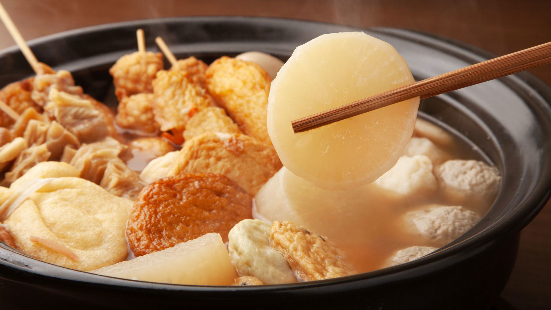 Traditional Japanese oden hot pot with various simmered ingredients