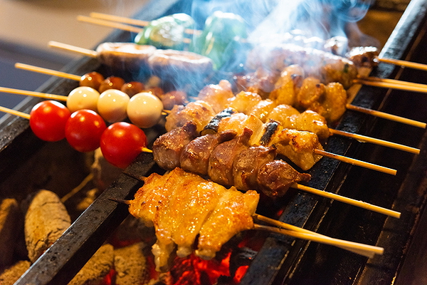 Grilled skewers with vegetables and meat at a restaurant barbecue