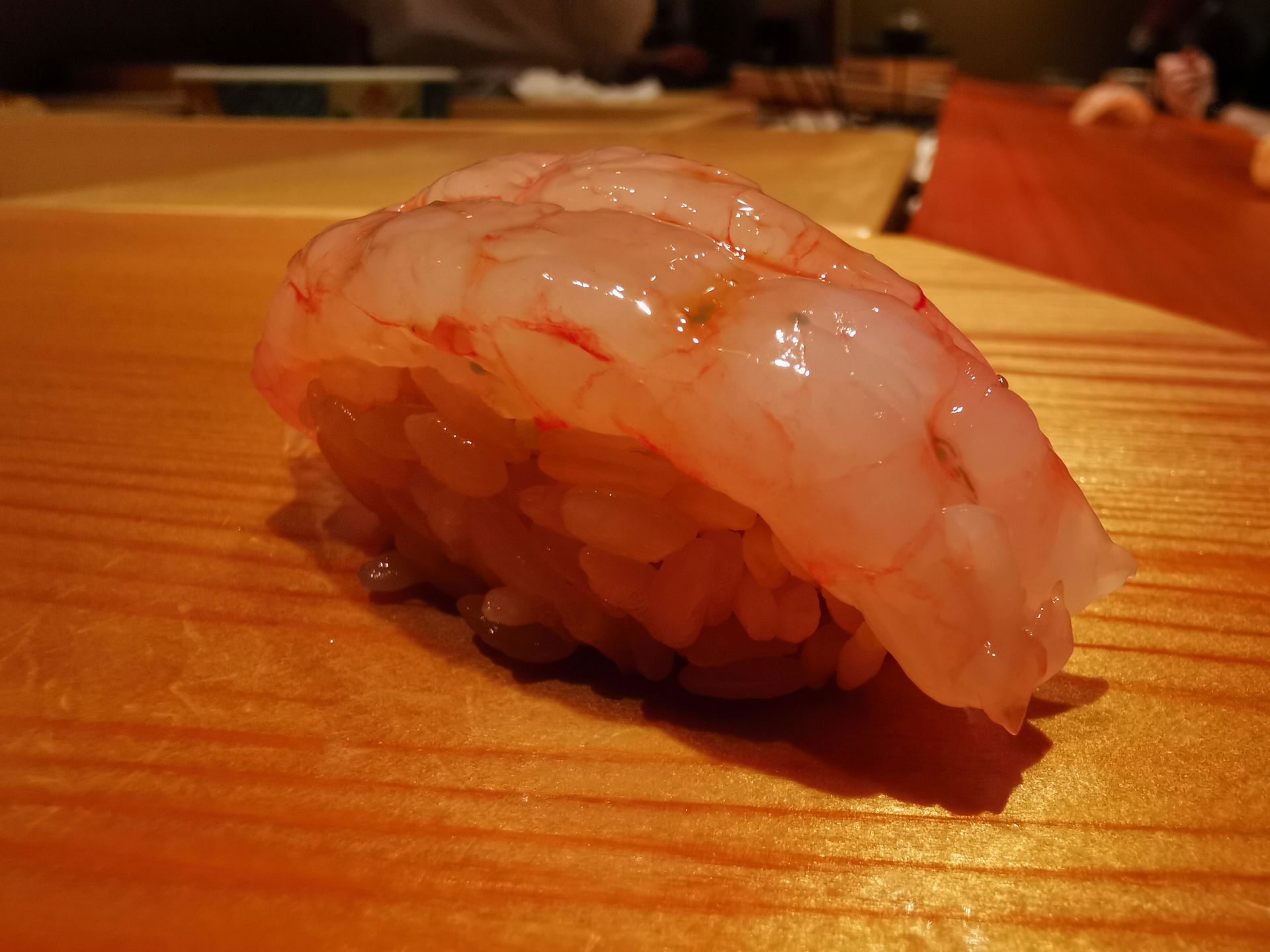 A close-up shot of generous prawn nigiri sushi at Nishiazabu Sushi Shin.