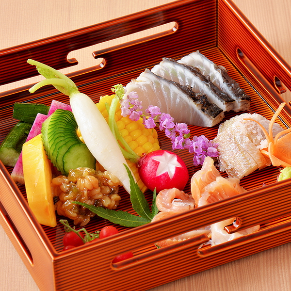 Elegant Japanese bento box with fresh sushi and vibrant vegetables