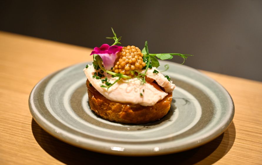 A stylish serving at Yakitori Matsuoka, featuring fresh ingredients and vivid colors.