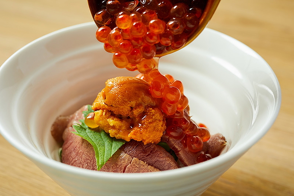 Gourmet bowl with fresh seafood and meat delicacies