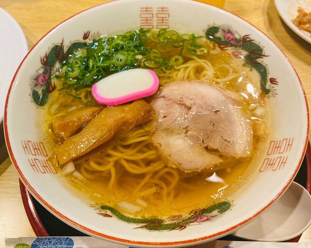 A bowl of ramen at Fukuya, featuring noodles, bamboo shoots, fishcake and pork.