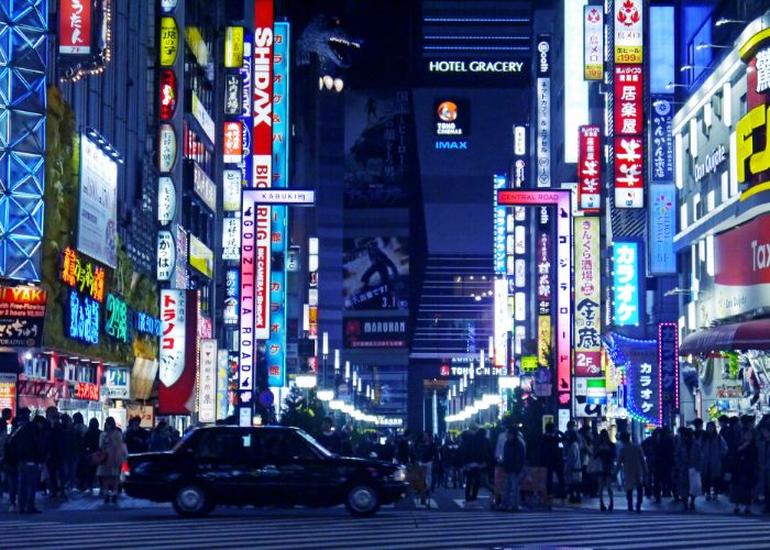 A shot of a popular crossing in Shinjuku with a view of Toho Cinema