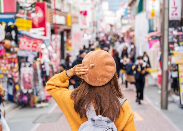 A woman walking down Takeshita Street in Harajuku