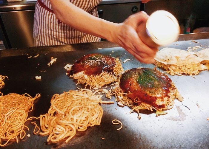 Hiroshima-style okonomiyaki on a teppanyaki grill