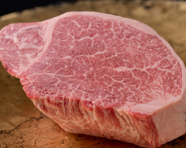 Marbled Wagyu beef steak on a wooden board